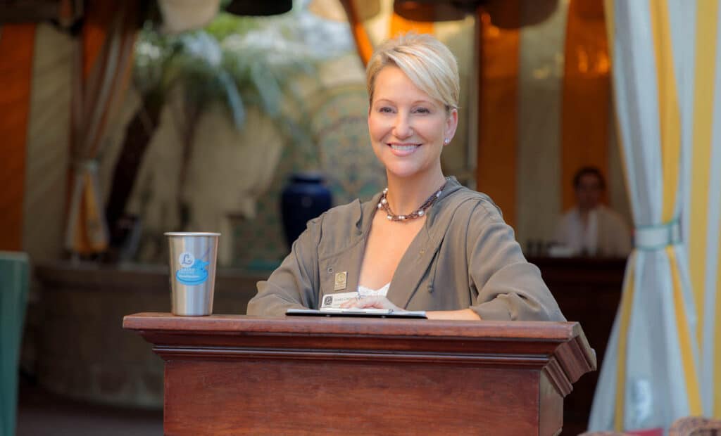 Woman smiling at the entrance to the Lobero Theatre