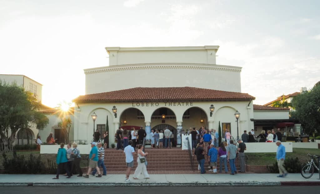 Lobero Theatre exterior with people arriving