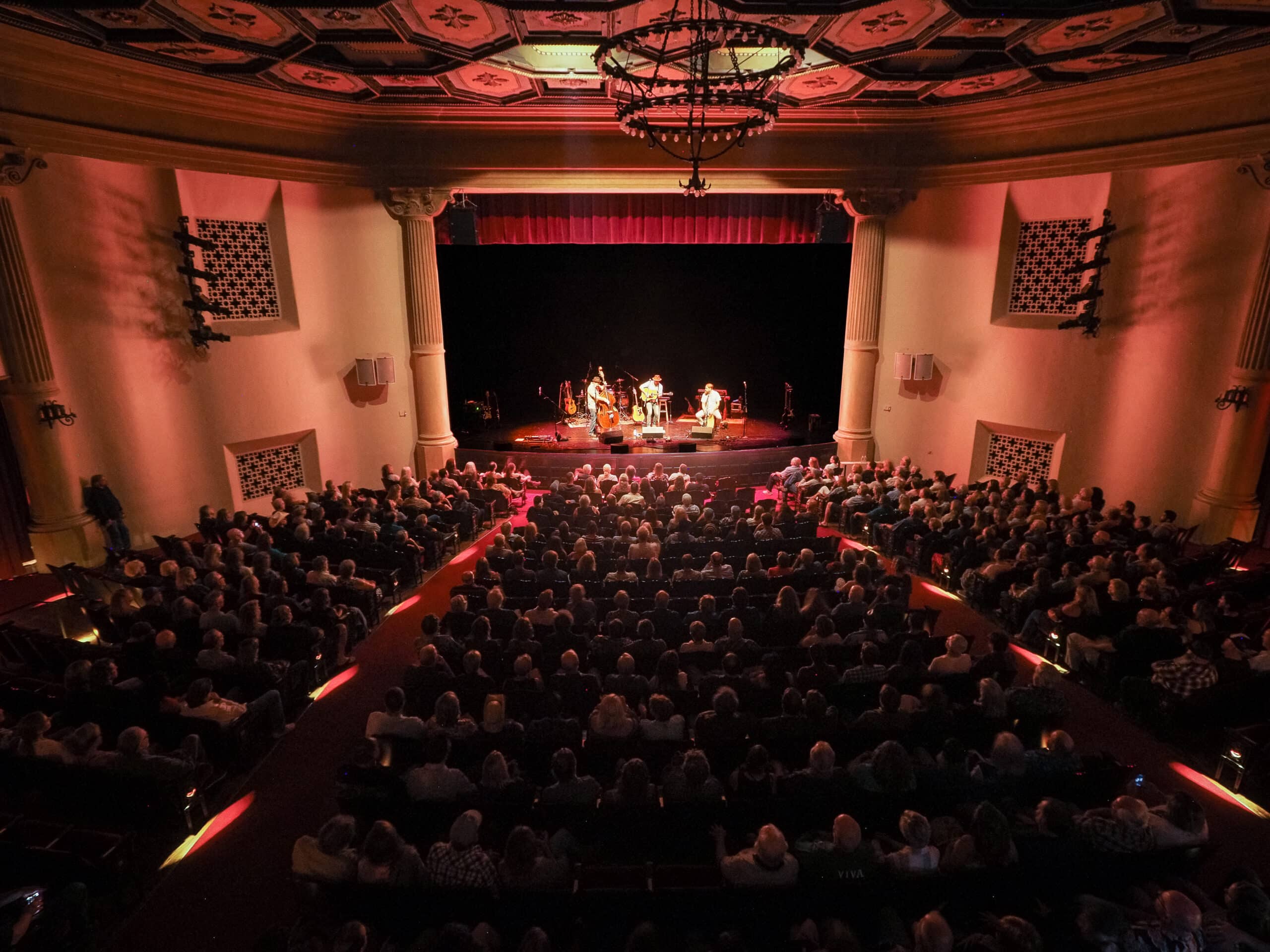 View of a band playing on stage from the sound booth at the Lobero Theatre