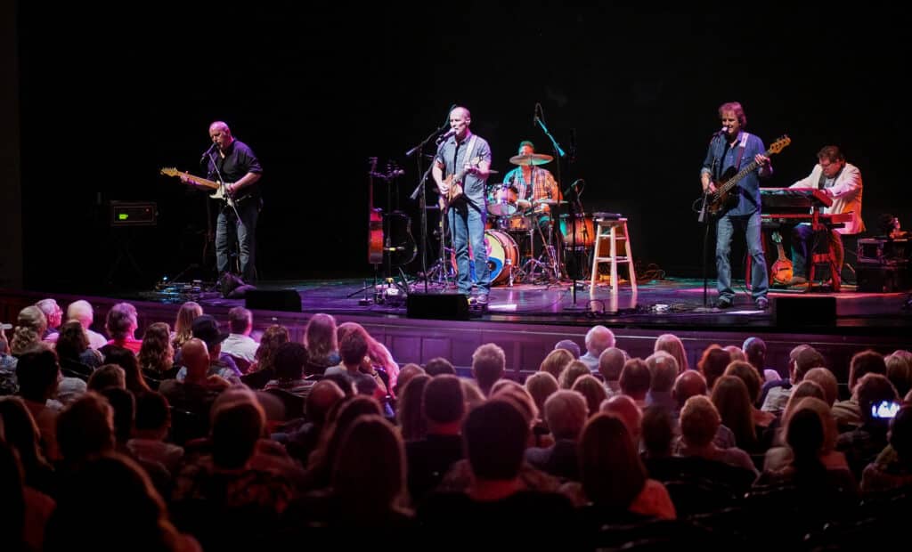 Band on stage playing at the Lobero Theatre audience view