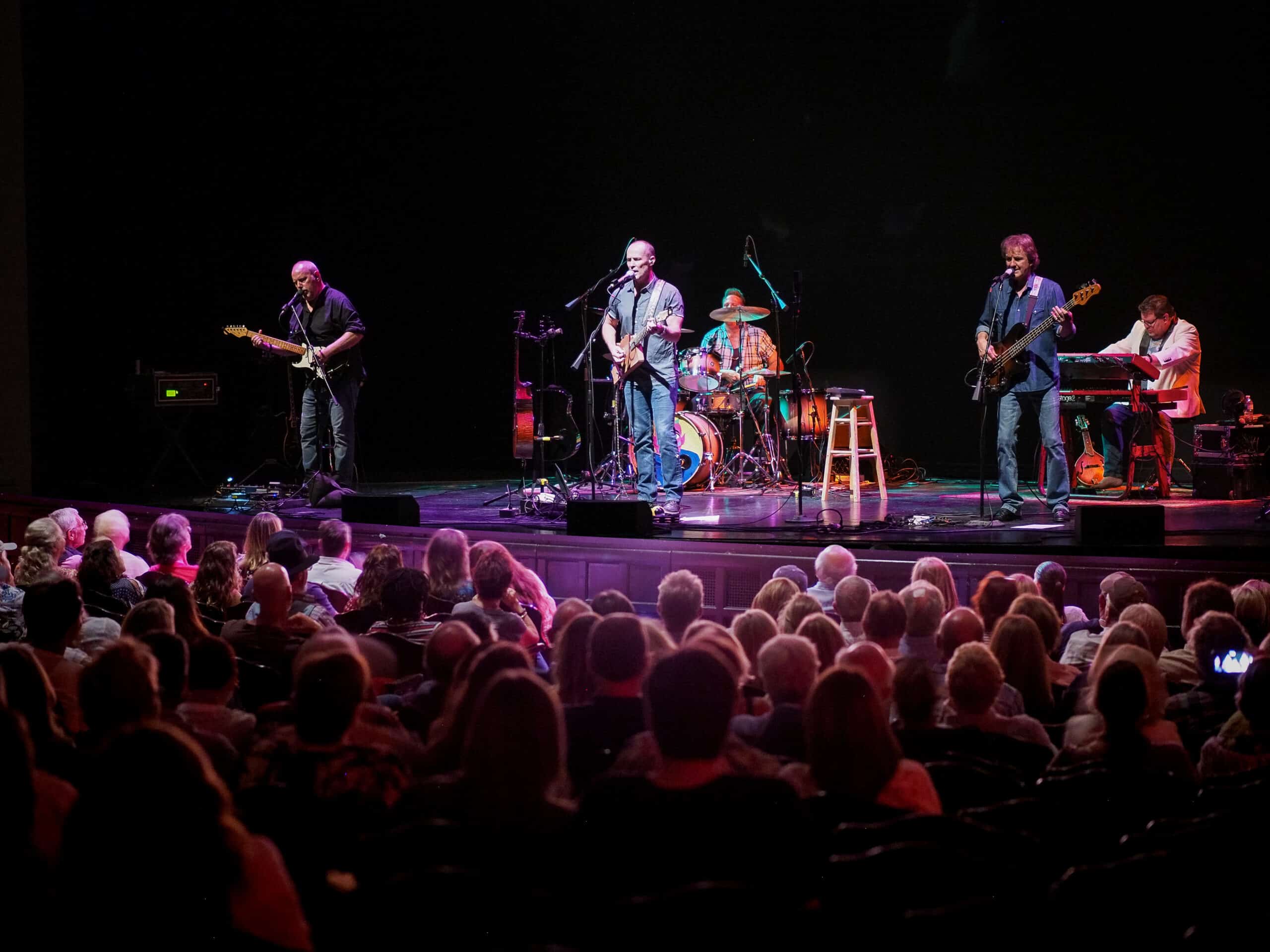 Band on stage playing at the Lobero Theatre audience view