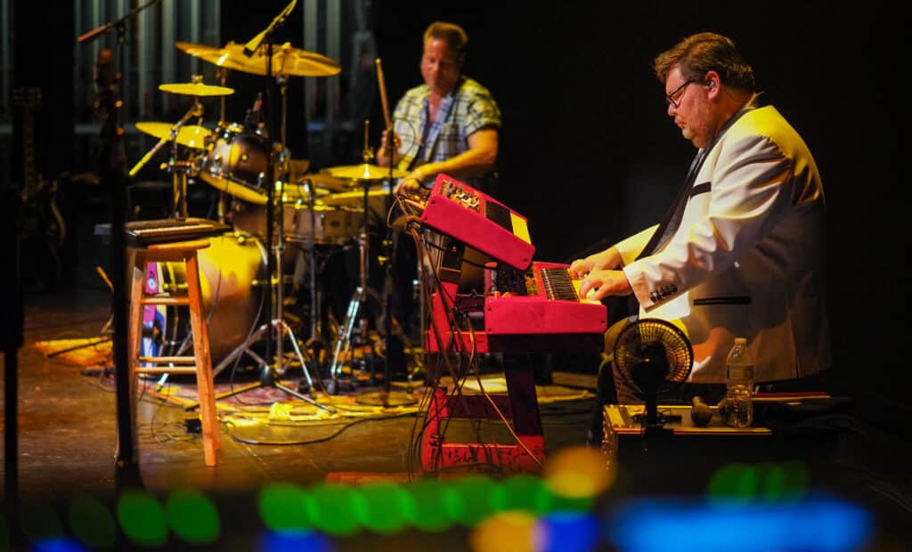 Musicians on stage playing at the Lobero Theatre