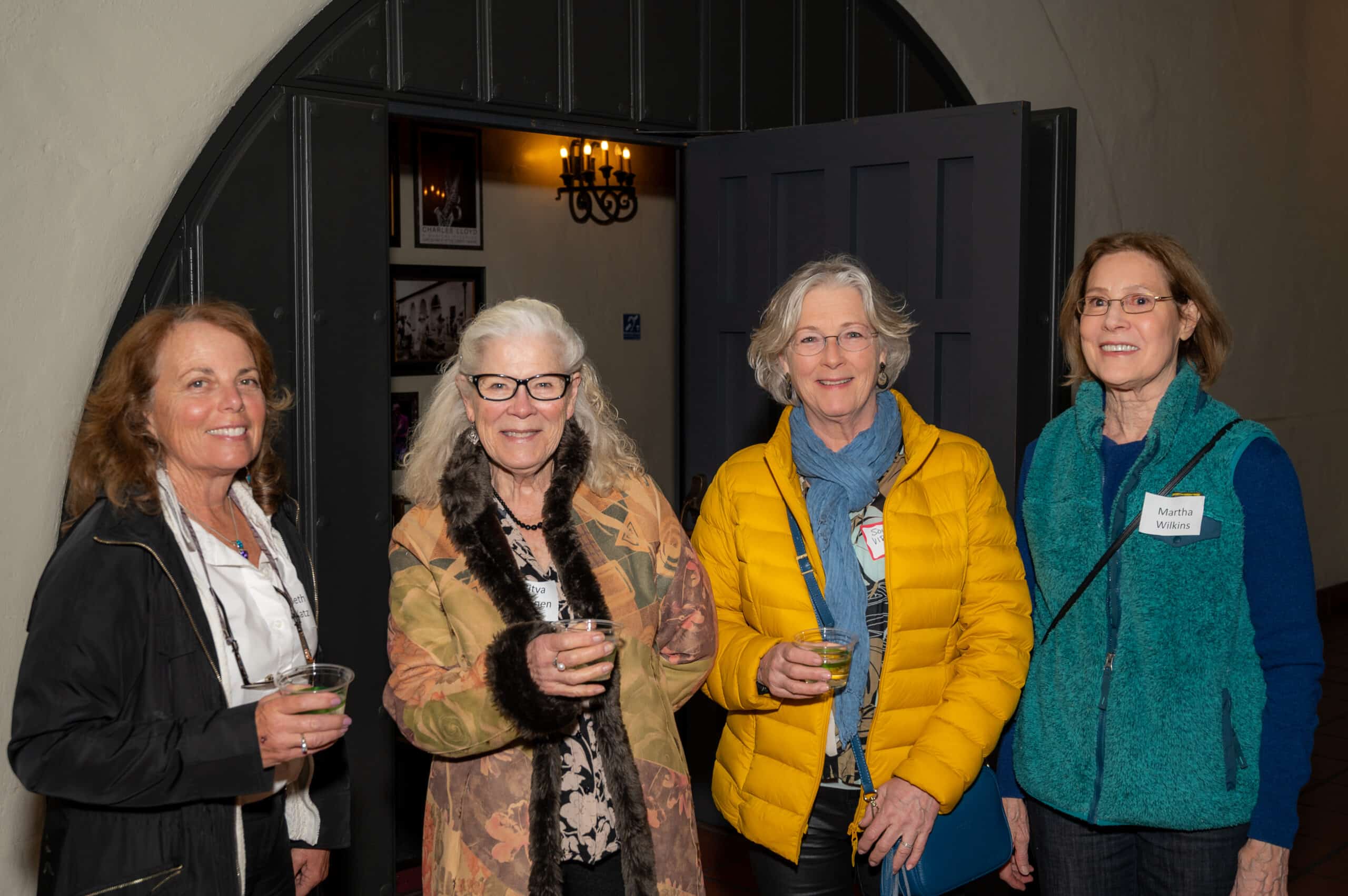 Four Lobero Theatre ushers at a party